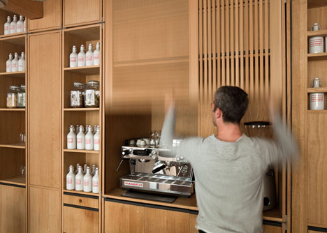 Buero Wagner suspends bottles of foraged ingredients from ceiling of cocktail bar