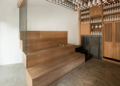 Buero Wagner suspends bottles of foraged ingredients from ceiling of cocktail bar