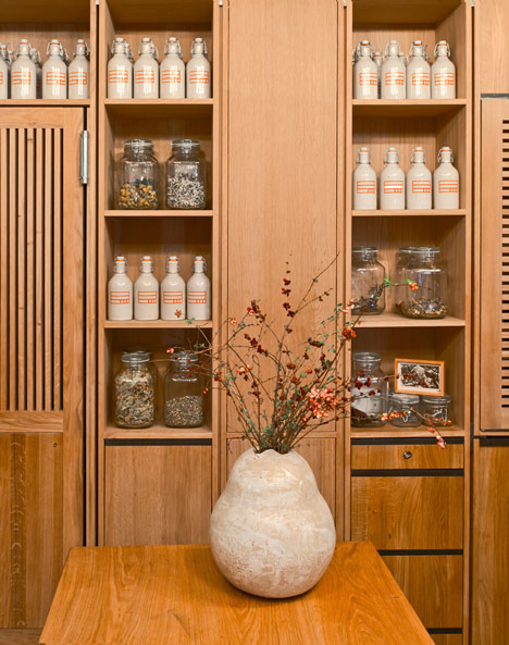 Buero Wagner suspends bottles of foraged ingredients from ceiling of cocktail bar