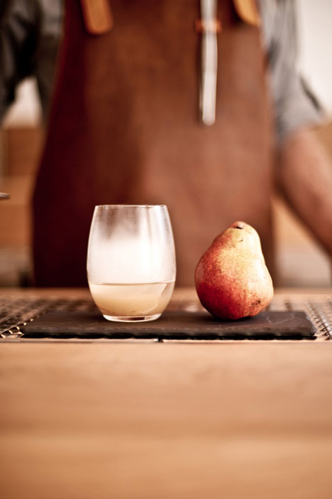 Buero Wagner suspends bottles of foraged ingredients from ceiling of cocktail bar