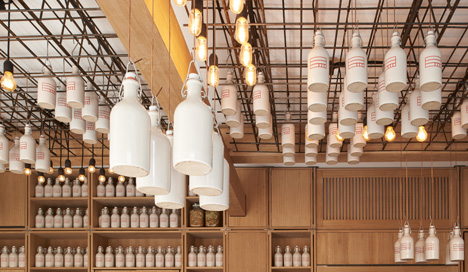 Buero Wagner suspends bottles of foraged ingredients from ceiling of cocktail bar