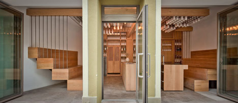 Buero Wagner suspends bottles of foraged ingredients from ceiling of cocktail bar