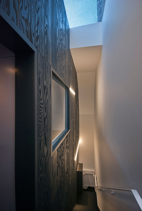 Long staircase spans converted London apartment by PATALAB Architecture