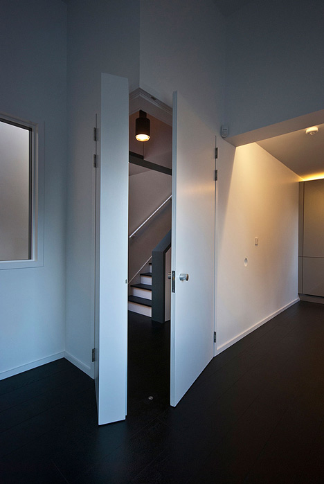 Long staircase spans converted London apartment by PATALAB Architecture