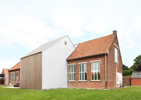 Community Centre Woesten by Atelier Tom Vanhee has a contrasting gabled extension