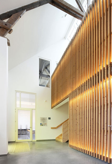Community Centre Woesten by Atelier Tom Vanhee has a contrasting gabled extension
