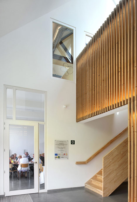 Community Centre Woesten by Atelier Tom Vanhee has a contrasting gabled extension