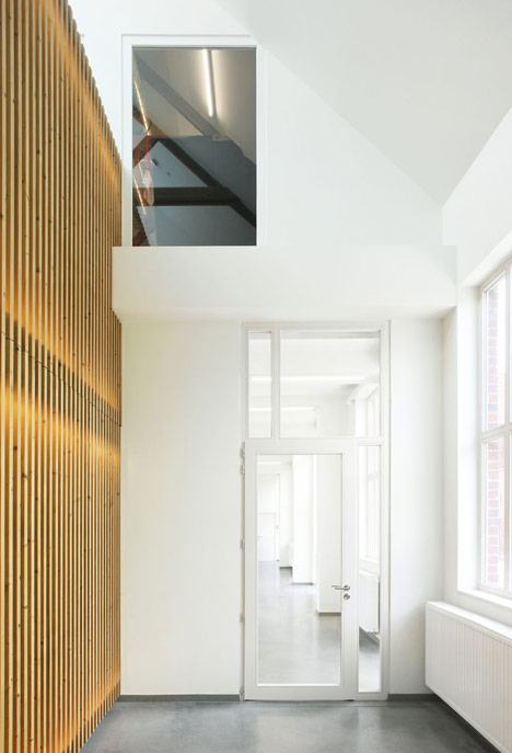 Community Centre Woesten by Atelier Tom Vanhee has a contrasting gabled extension