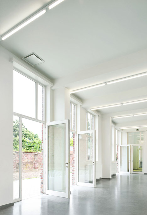 Community Centre Woesten by Atelier Tom Vanhee has a contrasting gabled extension