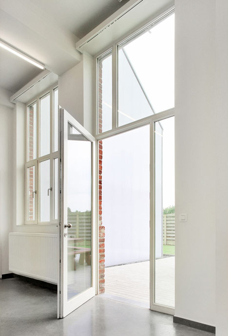 Community Centre Woesten by Atelier Tom Vanhee has a contrasting gabled extension