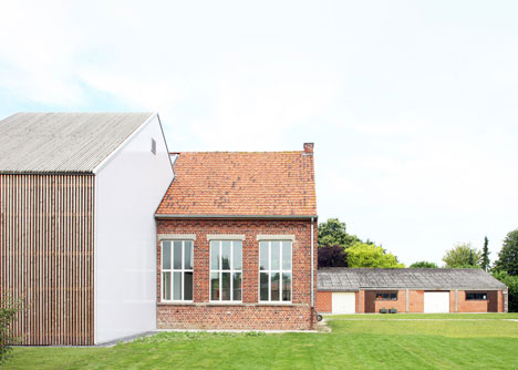 Community Centre Woesten by Atelier Tom Vanhee has a contrasting gabled extension