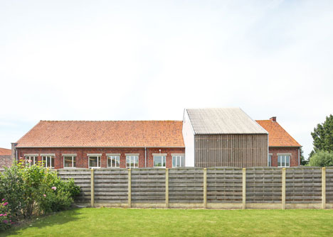 Community Centre Woesten by Atelier Tom Vanhee has a contrasting gabled extension