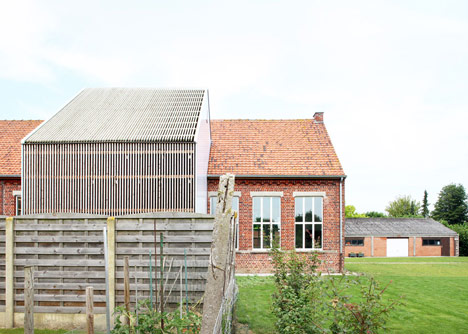 Community Centre Woesten by Atelier Tom Vanhee has a contrasting gabled extension