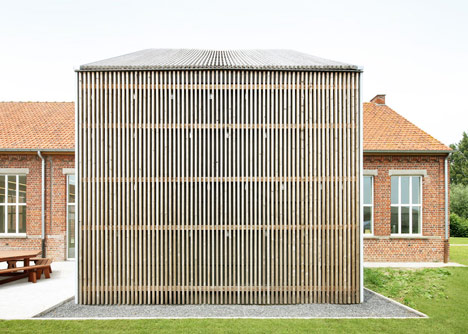 Community Centre Woesten by Atelier Tom Vanhee has a contrasting gabled extension