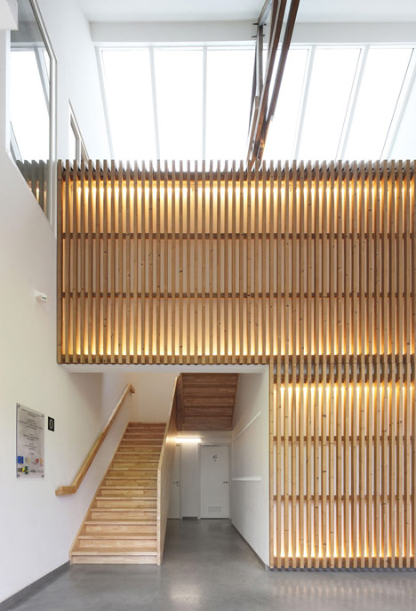 Community Centre Woesten by Atelier Tom Vanhee has a contrasting gabled extension