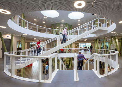 Ecological university building by BDG Architects features a cylindrical facade
