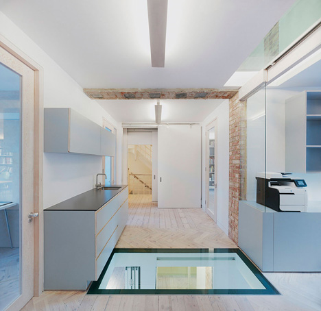 Edwardian townhouse renovation by Studio Octopi features windows in the floors