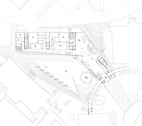 Ground floor plan of Grand orange staircase ascends through college by Saucier + Perrotte