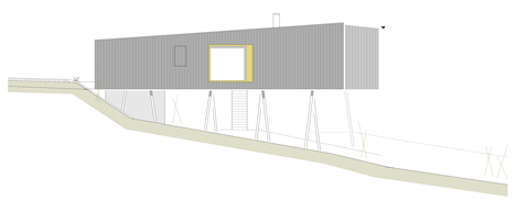 Black-painted S House by Hammerschmid Pachl Seebacher raised up on stilts