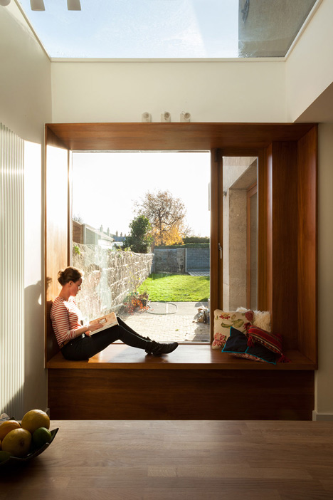 House extension by GKMP Architects includes a wooden window seat