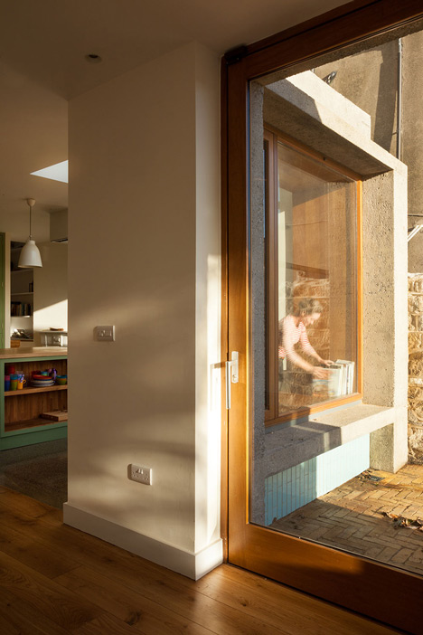 House extension by GKMP Architects includes a wooden window seat