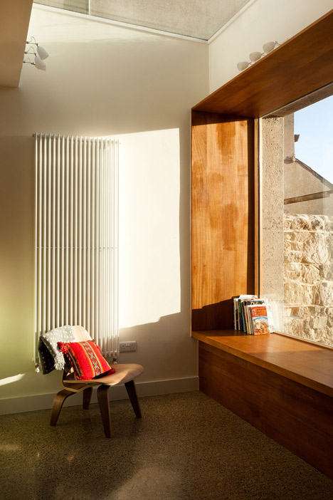 House extension by GKMP Architects includes a wooden window seat