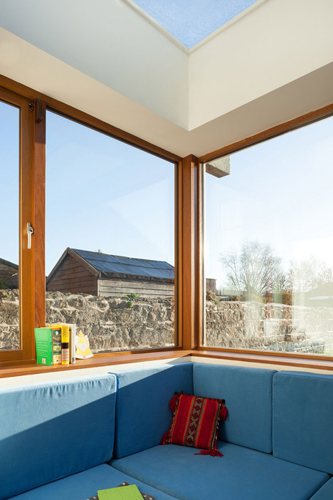 House extension by GKMP Architects includes a wooden window seat