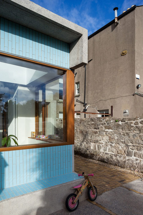 House extension by GKMP Architects includes a wooden window seat