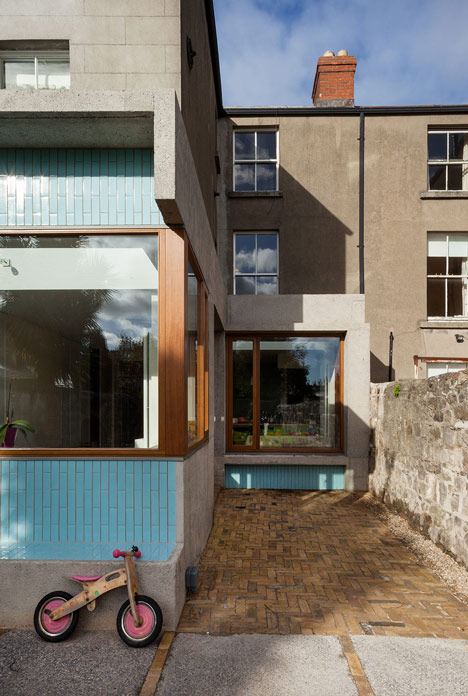House extension by GKMP Architects includes a wooden window seat