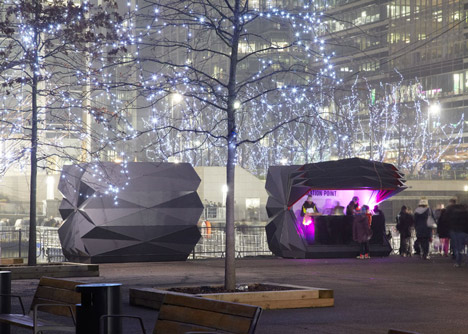 Folded metal kiosks by Make open like a paper fan