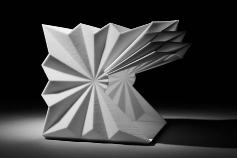Folded metal kiosks by Make open like a paper fan