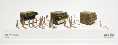 Folded metal kiosks by Make open like a paper fan