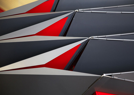 Folded metal kiosks by Make open like a paper fan