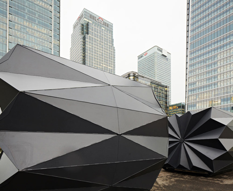 Folded metal kiosks by Make open like a paper fan