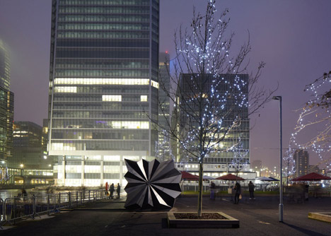 Folded metal kiosks by Make open like a paper fan