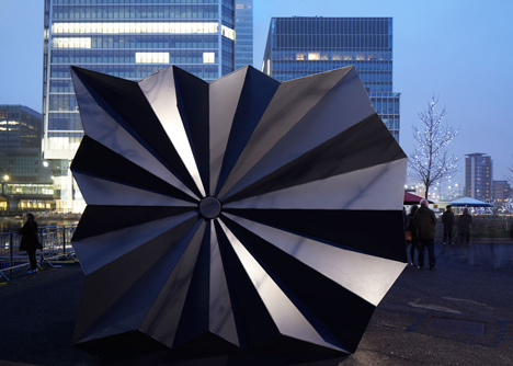 Folded metal kiosks by Make open like a paper fan