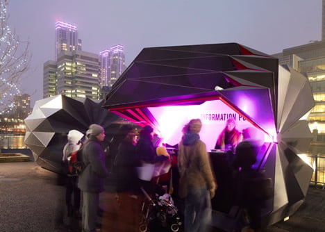 Folded metal kiosks by Make open like a paper fan