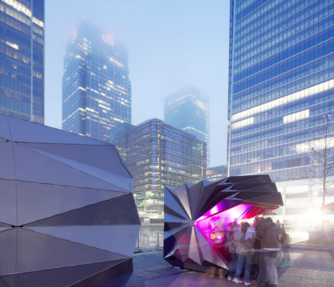 Folded metal kiosks by Make open like a paper fan