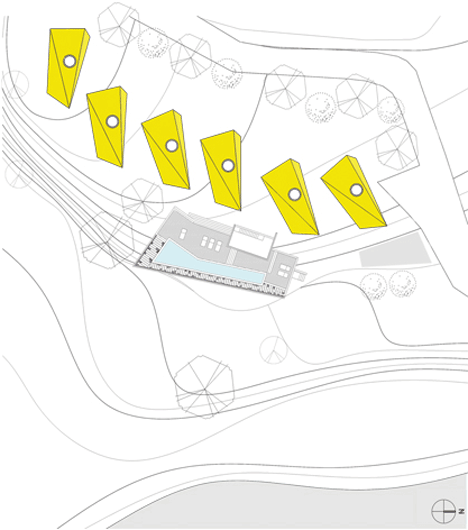 Asymmetric holiday homes by Studio Koossino feature bright yellow walls