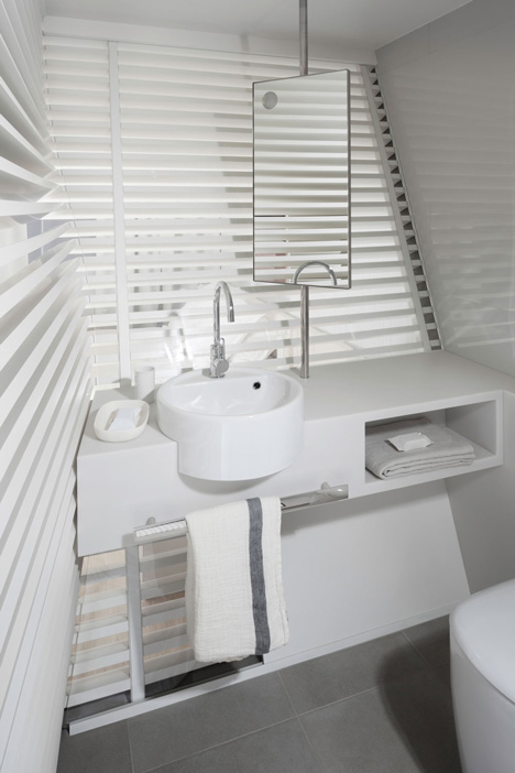 Okko hotel interior by Patrick Norguet with en suites hidden behind louvred walls