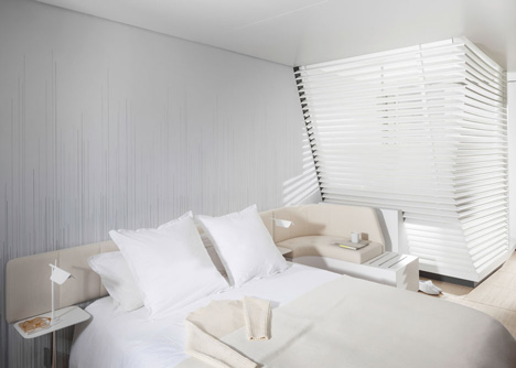 Okko hotel interior by Patrick Norguet with en suites hidden behind louvred walls