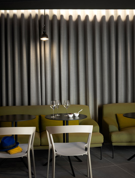 Okko hotel interior by Patrick Norguet with en suites hidden behind louvred walls
