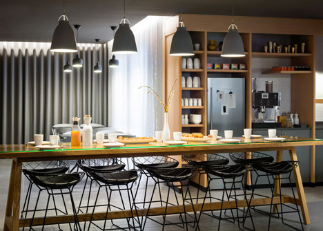 Okko hotel interior by Patrick Norguet with en suites hidden behind louvred walls