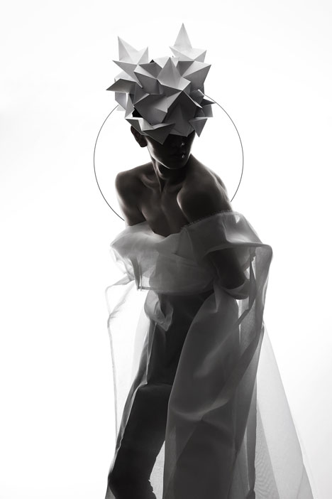 Origami headgear folded to resemble mythological creatures