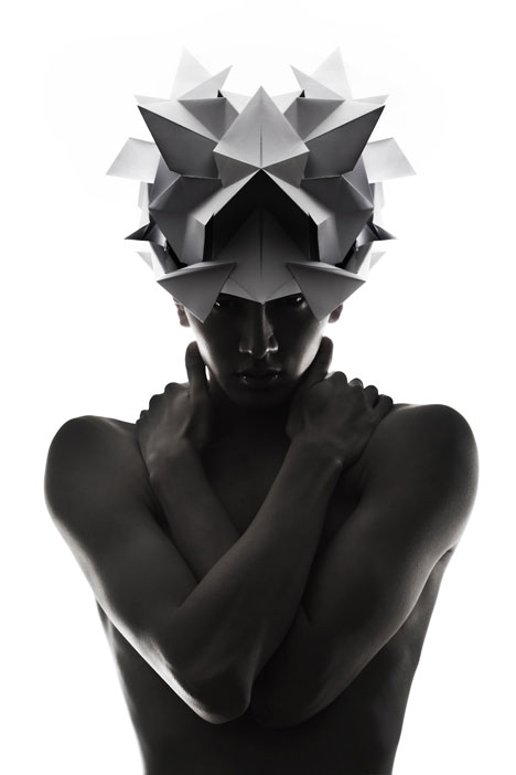 Origami headgear folded to resemble mythological creatures