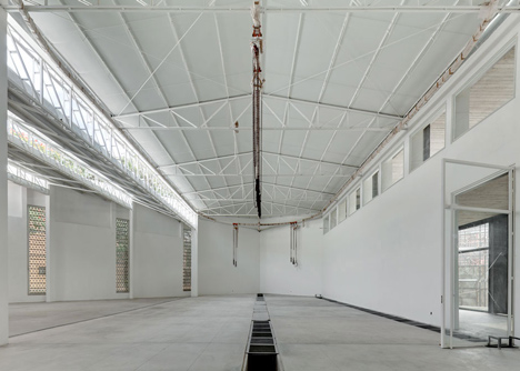 Perforated concrete walls encase La Tallera gallery by Frida Escobedo