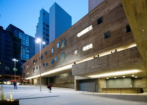 Praca das Artes by Brasil Arquitetura features concrete boxes projecting over a public plaza