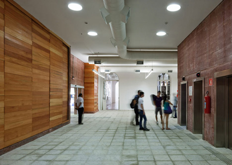 Praca das Artes by Brasil Arquitetura features concrete boxes projecting over a public plaza