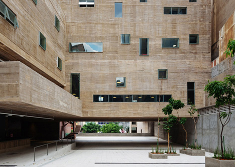 Praca das Artes by Brasil Arquitetura features concrete boxes projecting over a public plaza
