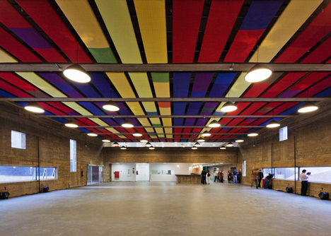 Praca das Artes by Brasil Arquitetura features concrete boxes projecting over a public plaza